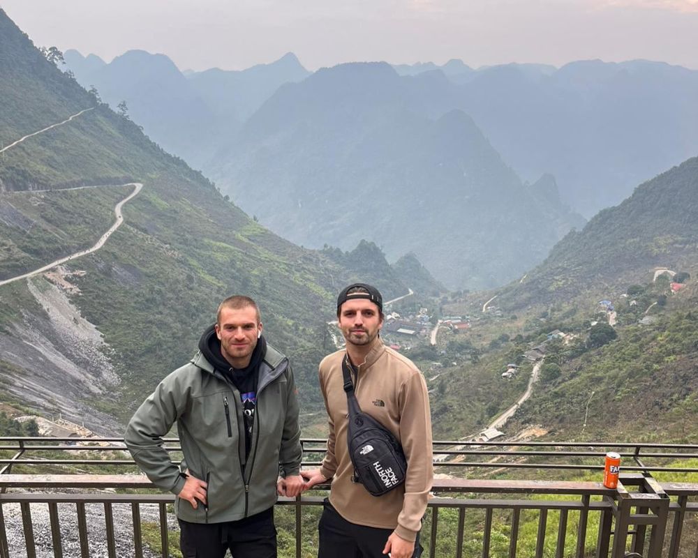 Two-man-taking-a-photo-on-the-Ha-Giang-loop