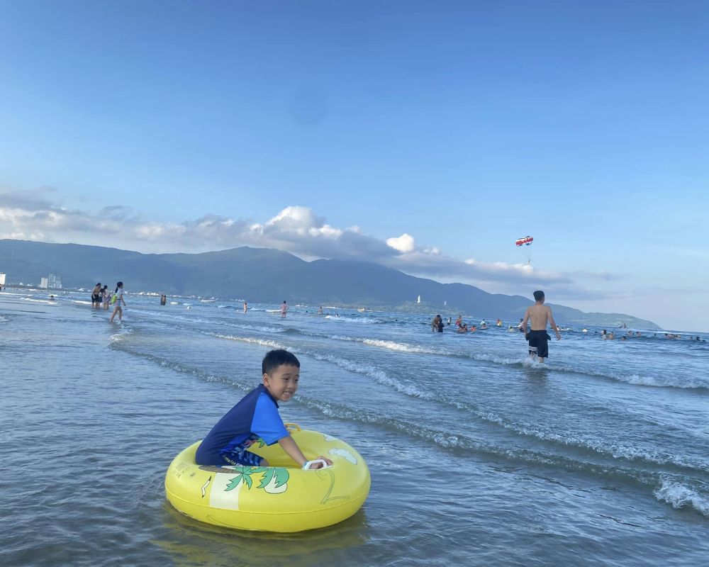 Local-people-gather-to-swim-at-My-Khe-beach