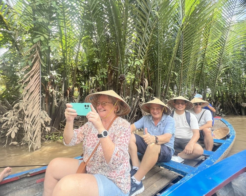 A-group-of-tourists-experiences-traveling-the-Mekong-Delta-by-boat