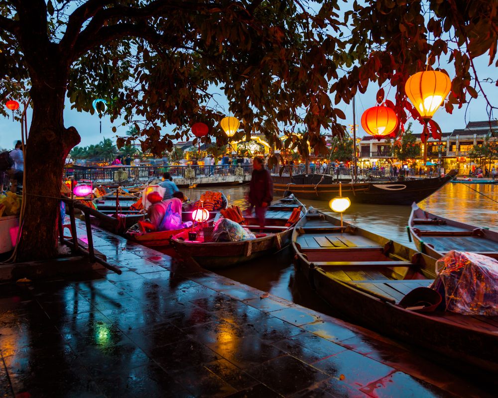 Hoian-Vietnam-street-view-with-traditional-boats-on-a-background-of-ancient-town